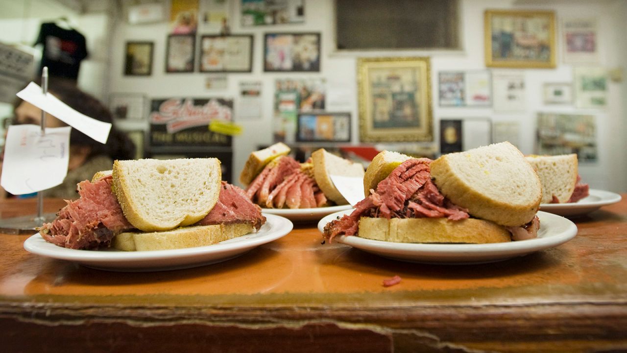<strong>Montreal smoked meat sandwich, Canada: </strong><br />Smoked meat sandwiches sit on the counter at Schwartz's Deli in Montreal. It's made with smoked beef brisket layered between slices of light rye bread and drizzled with tangy yellow mustard.  