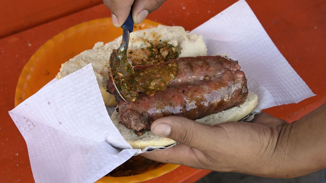 <strong>Choripán, Argentina: </strong>Sausages splashed with mustard and chimichurri sauce are the makings of this classic mouthful whose name is a mash-up of chorizo (sausage) and pan (bread). 