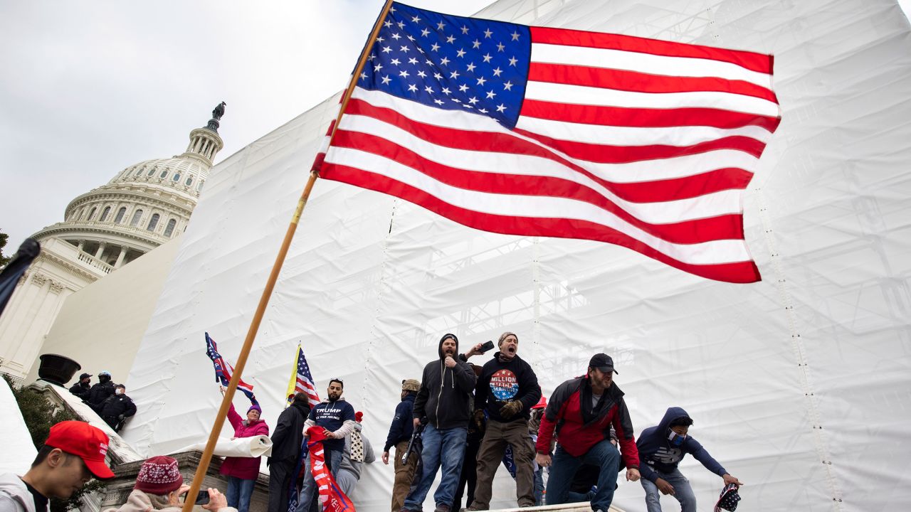 WASHINGTON, DC - JANUARY 06: Trump supporters clash with police and security forces as people try to storm the US Capitol in Washington D.C on January 6, 2021. Demonstrators breeched security and entered the Capitol as Congress debated the 2020 presidential election Electoral Vote Certification. 