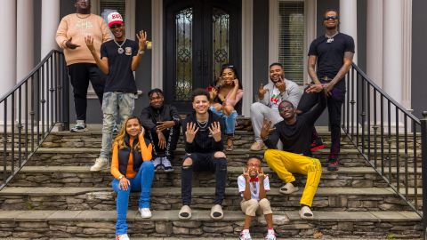 From left, Robert Dean III, Tray Bills, Khamyra Sykes, Oneil Rowe, Noah Webster, Kaychelle Dabney, Marcus Bolton, manager Keith Dorsey, Theodore Wisseh and Cameron Lee pose for a photo outside of the Collab Crib in Fayetteville, Georgia. Missing is the house's 10th creator, Kaelyn Castle. 