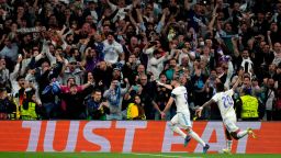 Real Madrid's Karim Benzema, left, celebrates his side's third goal during the Champions League semi final, second leg, soccer match between Real Madrid and Manchester City at the Santiago Bernabeu stadium in Madrid, Spain, Wednesday, May 4, 2022. (AP Photo/Bernat Armangue)