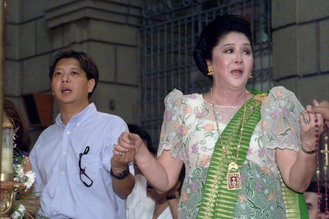Former Philippine first lady Imelda Marcos, the widow of dictator Ferdinand Marcos, with her son Ferdinand Marcos Jr. celebrating her 70th birthday in Manila.