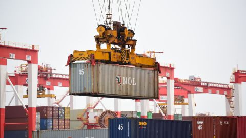 Cranes lift containers at Yangshan Deepwater Port on April 27, 2022 in Shanghai, China.