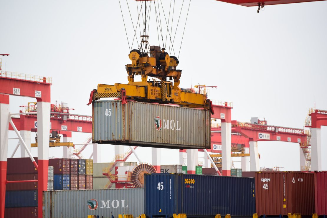 Cranes lift containers at Yangshan Deepwater Port on April 27, 2022 in Shanghai, China.