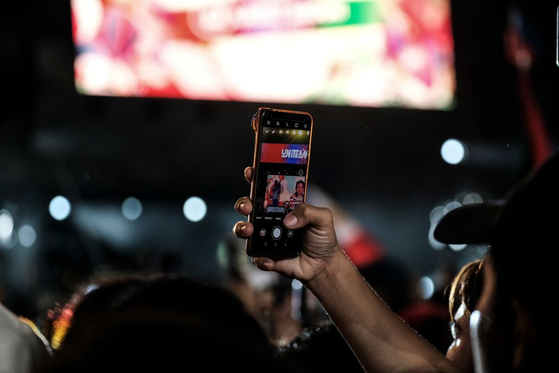 Supporters of presidential candidate Ferdinand Marcos Jr record the presentations during a campaign sortie in San Fernando City, Pampanga, on April 29. 