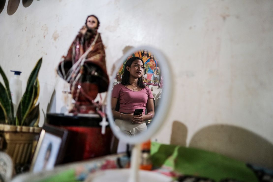 Alyza Natiag, a customer service representative, poses for a portrait in her house in Antipolo City, Philippines, on April 27 before conducting a house-to-house campaign for Vice President Leni Robredo. 
