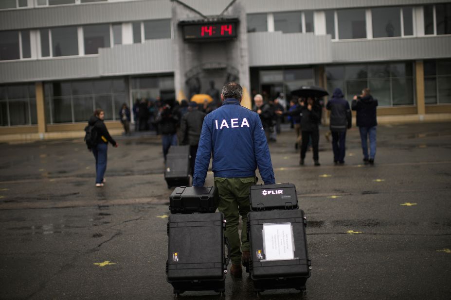 A team member with the International Atomic Energy Agency arrives at the Chernobyl nuclear power plant in Chernobyl, Ukraine, on April 26. Russian forces withdrew from Chernobyl, the site of the world's worst nuclear disaster, in March.