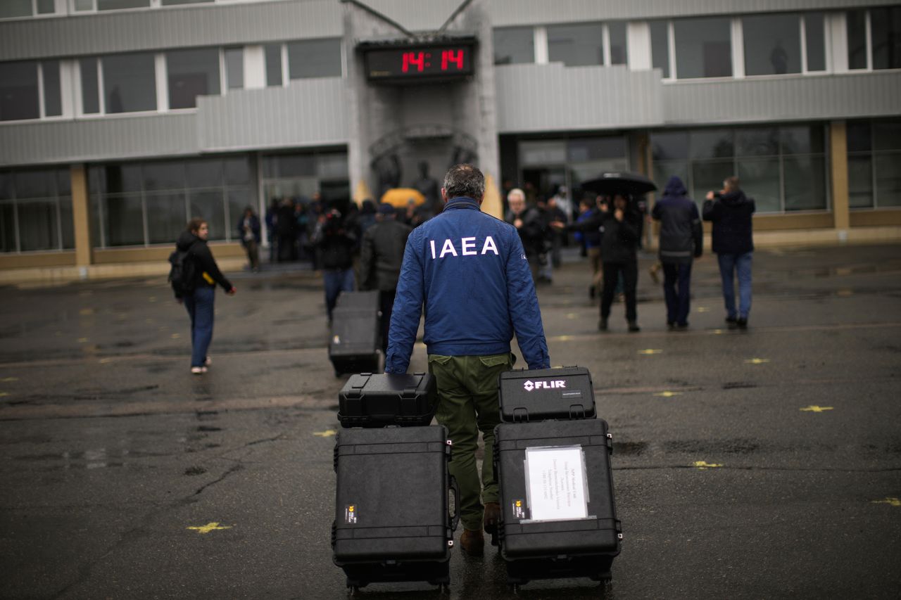 A team member with the International Atomic Energy Agency arrives at the Chernobyl nuclear power plant in Chernobyl, Ukraine, on April 26. Russian forces withdrew from Chernobyl, the site of the world's worst nuclear disaster, in March.