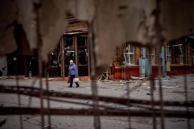A woman walks through the site of an explosion in Kyiv on April 29. Russia <a href="index.php?page=&url=https%3A%2F%2Fedition.cnn.com%2Feurope%2Flive-news%2Frussia-ukraine-war-news-04-29-22%2Fh_cd393e39bffe3851994e72f73fddf391" target="_blank">struck the Ukrainian capital</a> shortly after a meeting between Ukrainian President Volodymyr Zelensky and UN Secretary-General António Guterres.