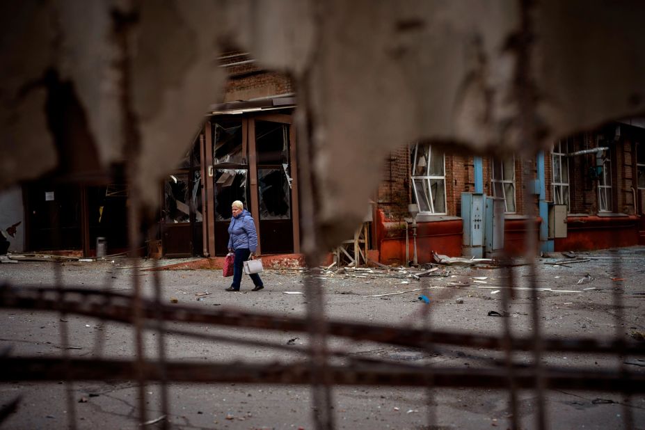 A woman walks through the site of an explosion in Kyiv on April 29. Russia <a href="https://edition.cnn.com/europe/live-news/russia-ukraine-war-news-04-29-22/h_cd393e39bffe3851994e72f73fddf391" target="_blank">struck the Ukrainian capital</a> shortly after a meeting between Ukrainian President Volodymyr Zelensky and UN Secretary-General António Guterres.