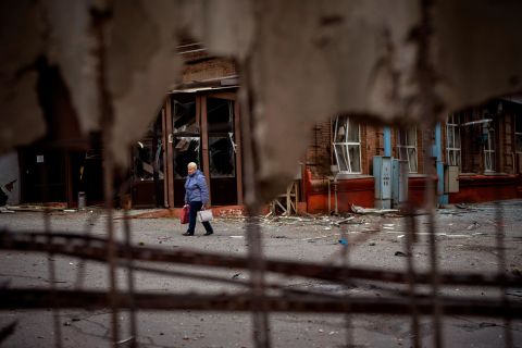 A woman walks through the site of an explosion in Kyiv on April 29. Russia struck the Ukrainian capital shortly after a meeting between Ukrainian President Volodymyr Zelensky and UN Secretary-General António Guterres.