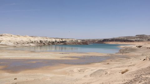 At Lake Powell, water recedes near Lone Rock Beach, a popular recreational area that used to be underwater, on April 20.