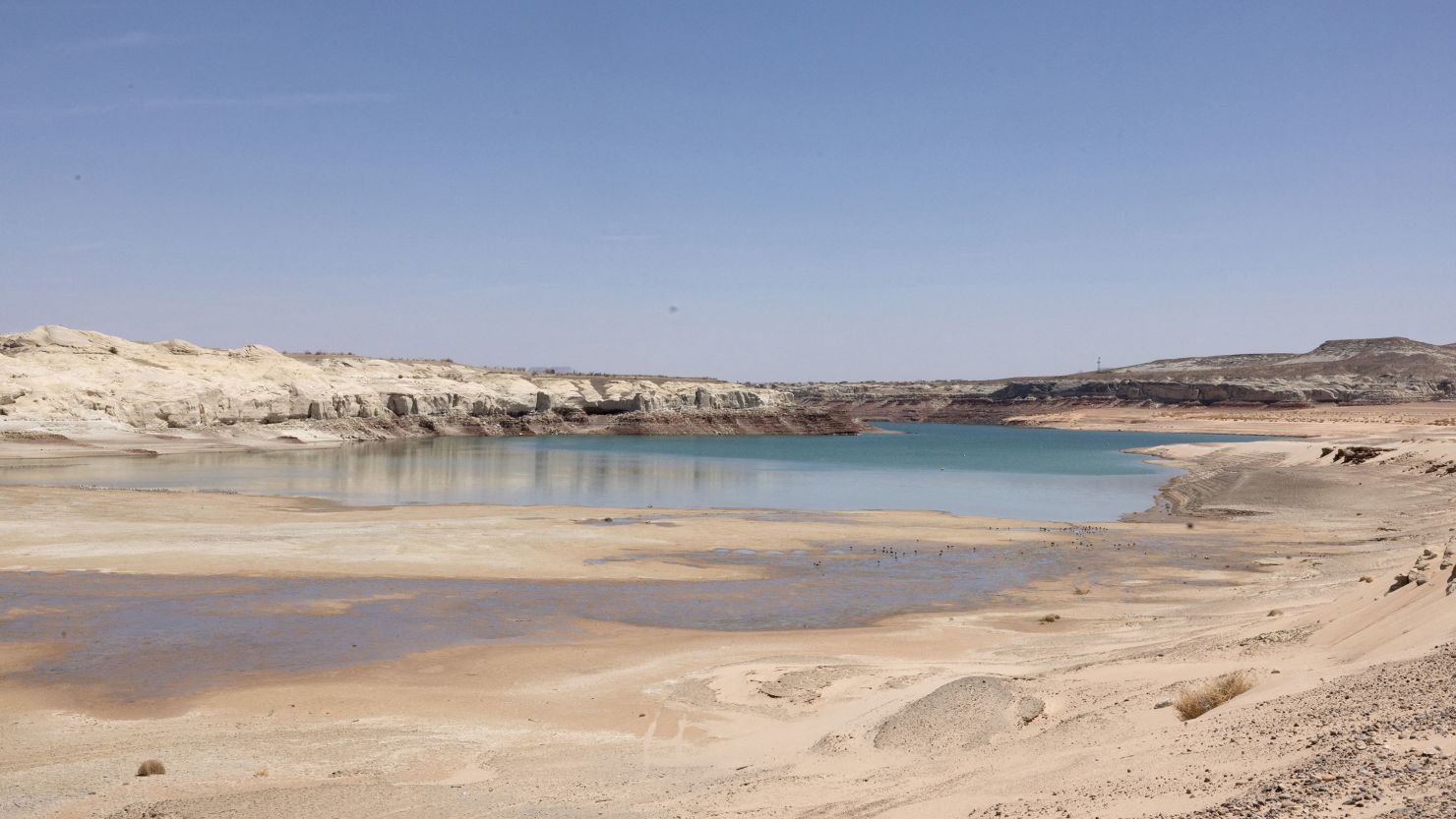 At Lake Powell, water recedes near Lone Rock Beach, a popular recreational area that used to be underwater, on April 20.