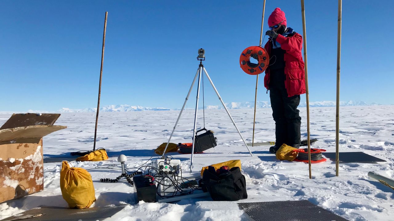 Researcher Chloe Gustafson, of UC San Diego's Scripps Institution of Oceanography, prepares to install a magnetotelluric station to map beneath the ice during 2018 field work in Antarctica. 