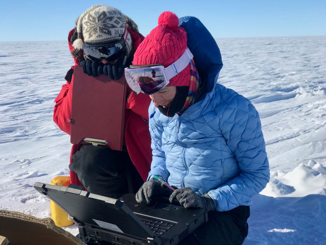 The team check the data from a magnetotelluric station they used to map beneath the ice sheet.