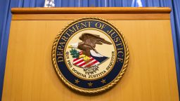 The U.S. Department of Justice seal on a podium in Washington, D.C., U.S., on Thursday, Aug. 5, 2021. The Justice Department has opened an investigation into the City of Phoenix and the Phoenix Police Department looking into types of use of force by Phoenix police department officers. Photographer: Samuel Corum/Bloomberg via Getty Images