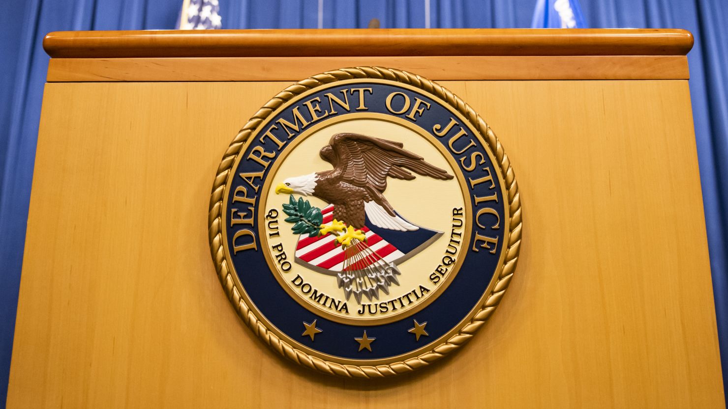 The Department of Justice seal on a podium in Washington, DC, on Thursday, August 5, 2021.