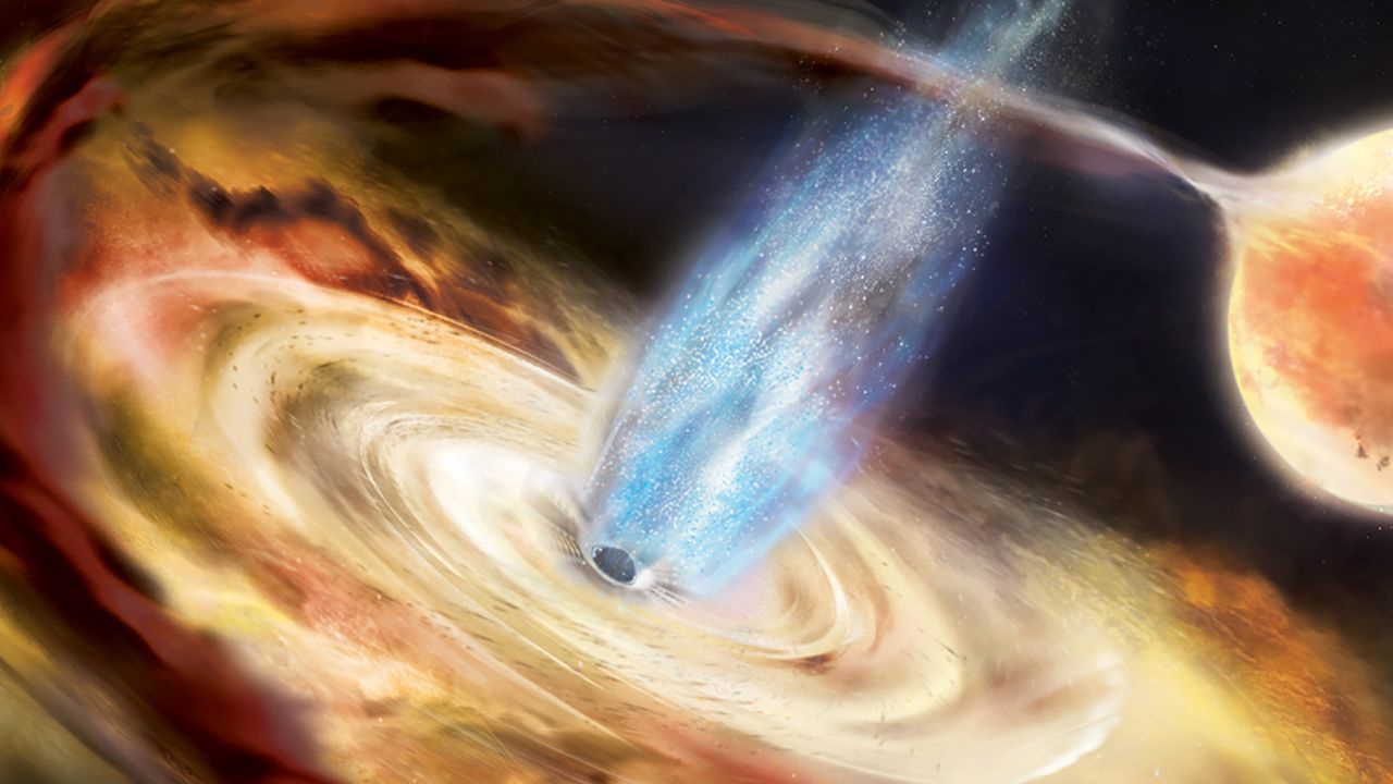 A black hole pulls material off a neighboring star and into an accretion disk in this illustration.