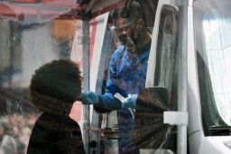 A person receives testing for the coronavirus this week from a van in New York's Times Square.