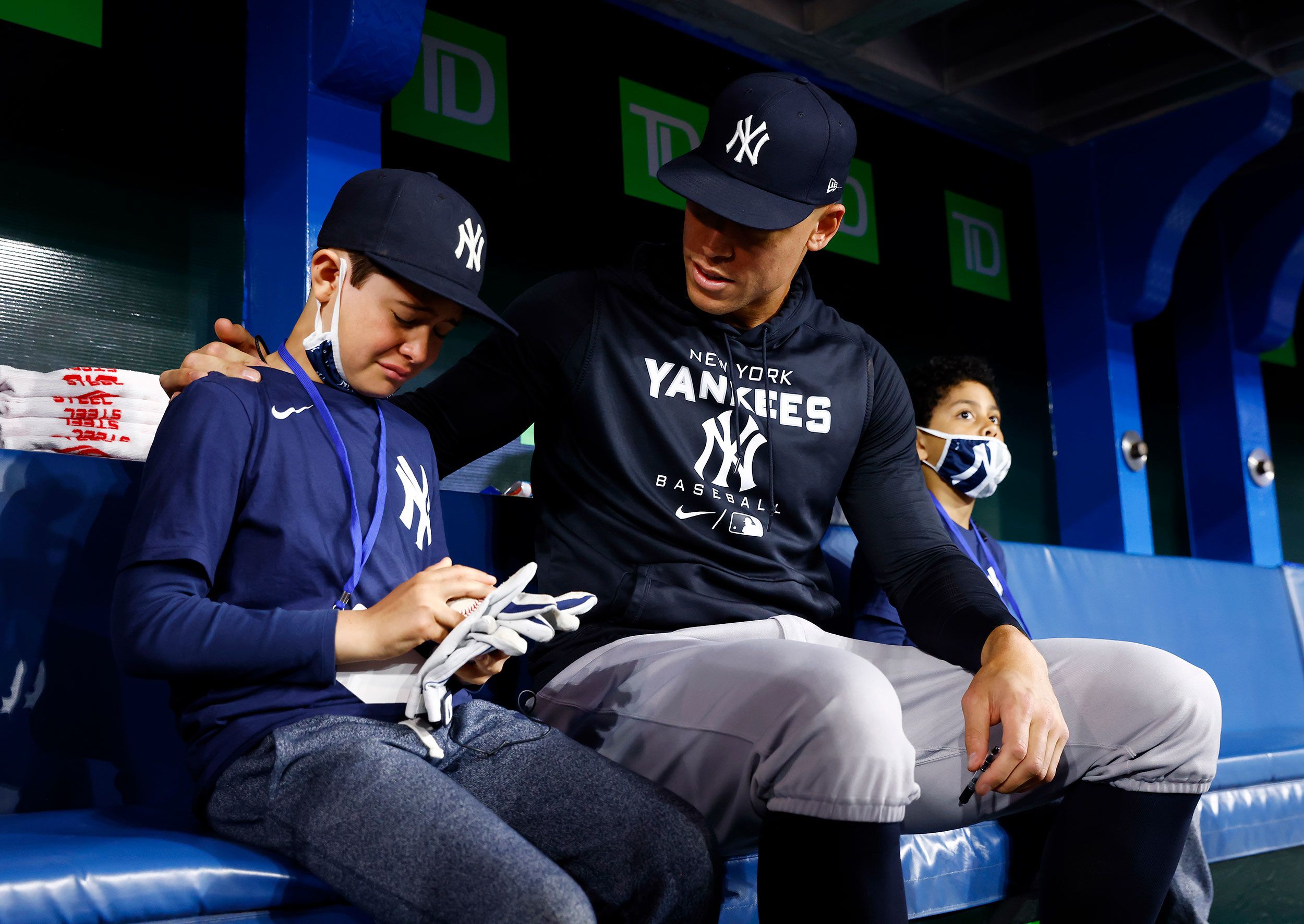 Derek Rodriguez reacts meeting his hero Aaron Judge before a baseball game.