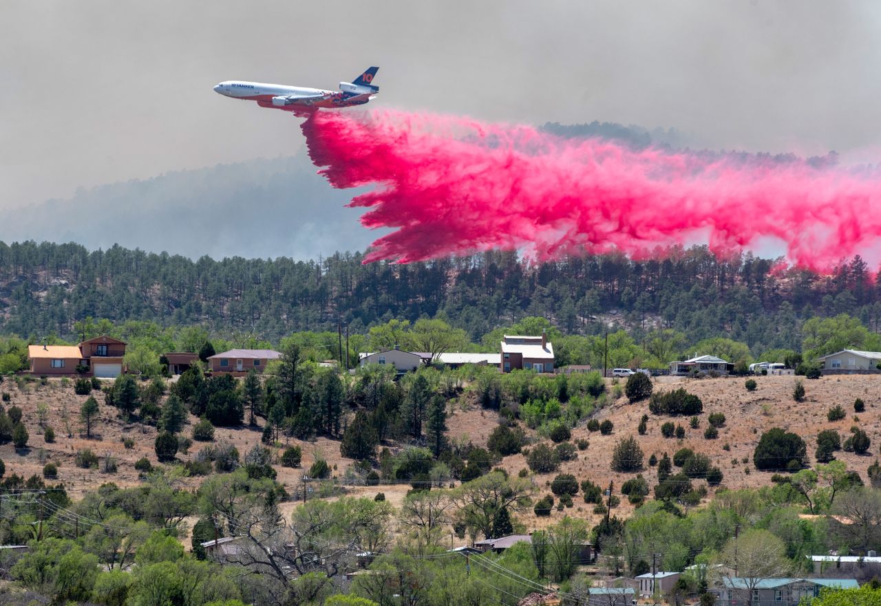 An aircraft dumps fire retardant in Las Vegas, New Mexico, on Tuesday, May 3. Wildfires and straight-line winds <a href="https://www.cnn.com/2022/05/05/us/new-mexico-wildfires-thursday/index.html" target="_blank">have ravaged New Mexico for a month.</a>