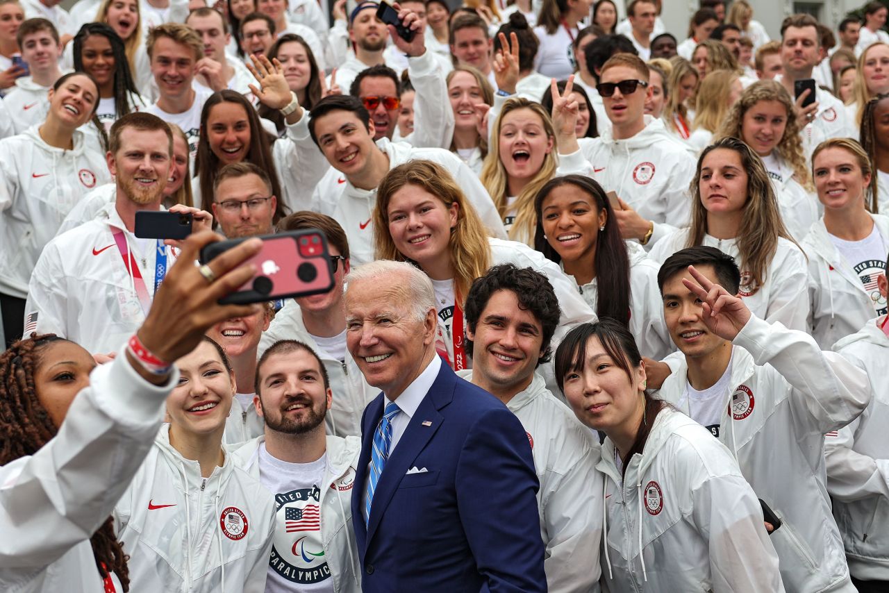 US President Joe Biden poses for a selfie with US Olympians and Paralympians who were <a href="https://www.cnn.com/2022/05/04/politics/team-usa-white-house-visit/index.html" target="_blank">visiting the White House</a> on Wednesday, May 4.