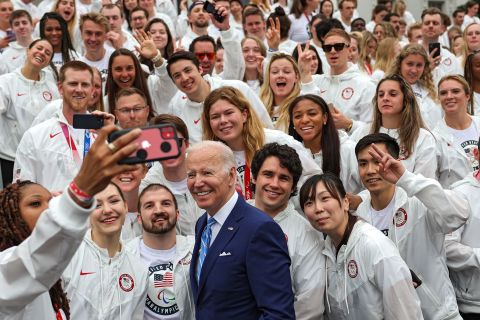 US President Joe Biden poses for a selfie with US Olympians and Paralympians who were <a href=