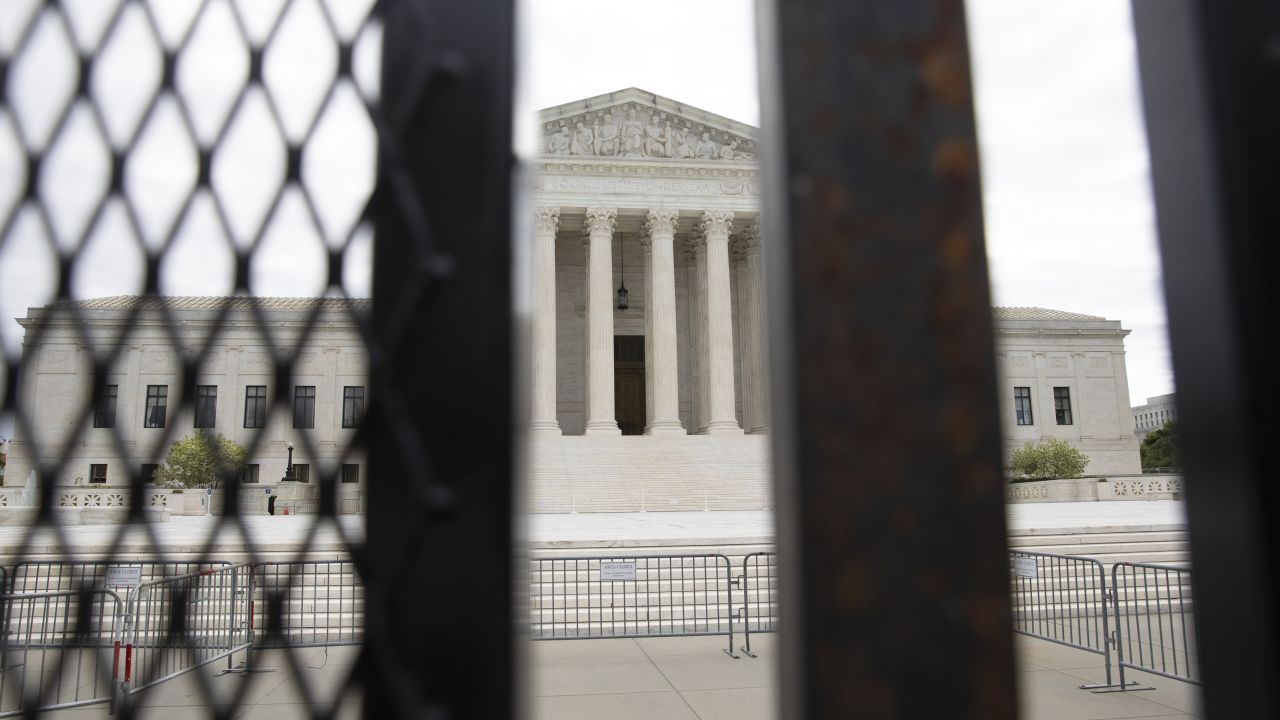  A metal barricade erected a previous night, surrounds the US Supreme Court, on May 5, 2022, in Washington, DC. 