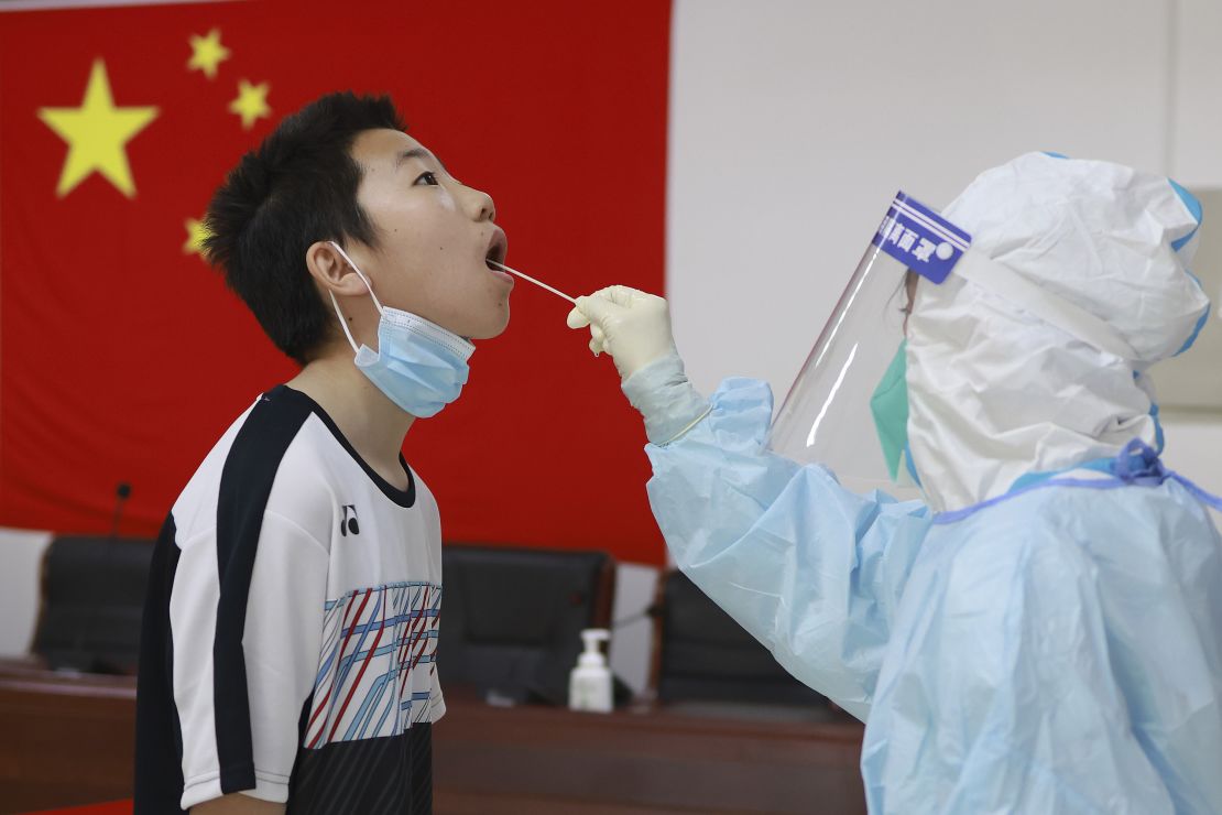 A boy receiving a Covid test in Beijing, China on May 4.