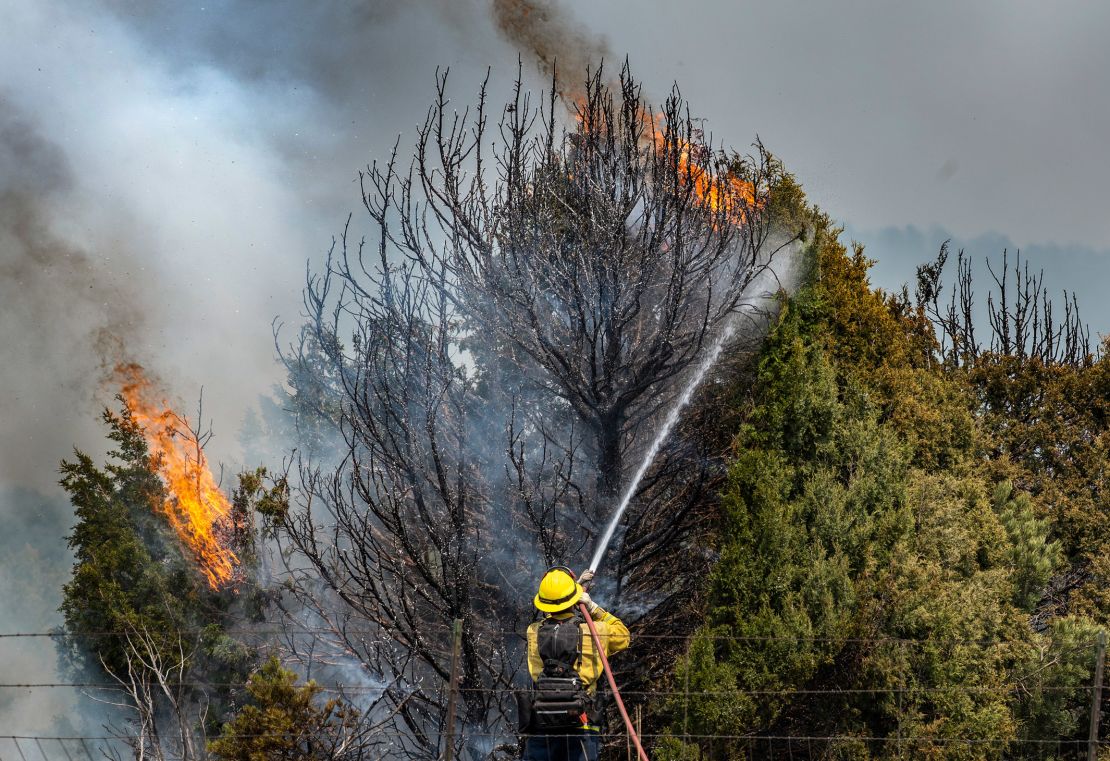 Firefighters on Thursday trying to hold the Calf Canyon/Hermit Peak Fire near Las Vegas, New Mexico. 