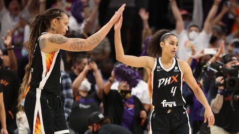 Brittney Griner, left, and Skylar Diggins-Smith celebrate after defeating the Chicago Sky in Game Two of the 2021 WNBA Finals at Footprint Center on October 13, 2021, in Phoenix.
