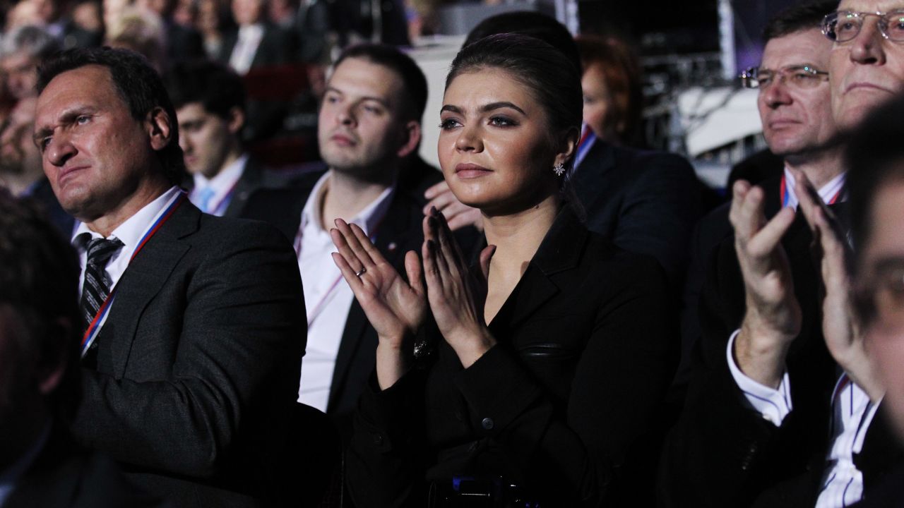 Kabaeva applauds as then-Prime Minister Vladimir Putin (not pictured) addresses the United Russia Party on November 27, 2011 in Moscow.