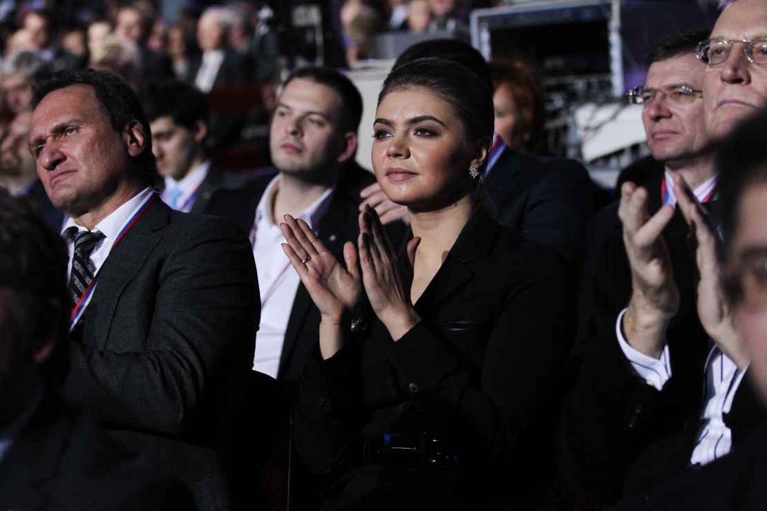 Kabaeva applauds as then-Prime Minister Vladimir Putin (not pictured) addresses the United Russia Party on November 27, 2011 in Moscow.