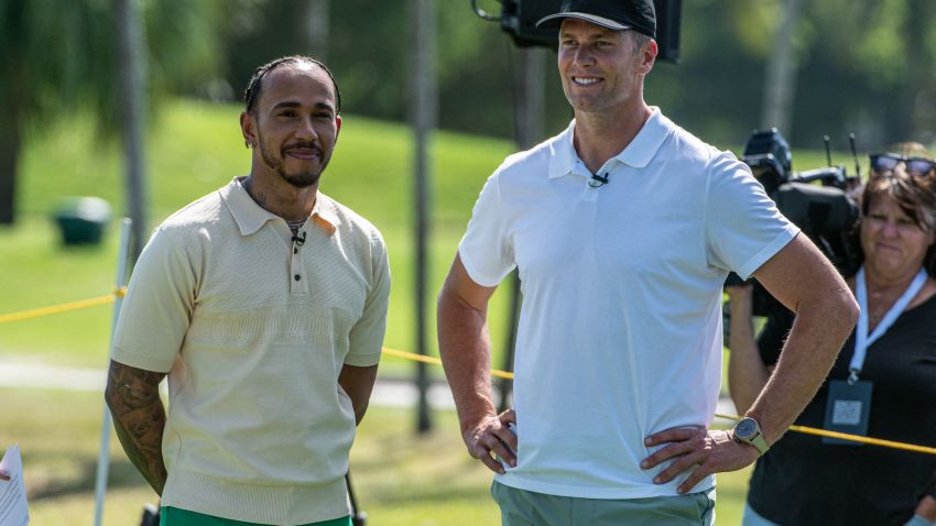 Mercedes' British driver Lewis Hamilton (L) and and NFL quarterback Tom Brady attend the Big Pilot Charity Challenge at the Miami Beach Golf Club, in Miami Beach, Florida on May 4, 2022. (Photo by Giorgio VIERA / AFP) (Photo by GIORGIO VIERA/AFP via Getty Images)