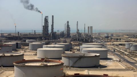 Crude oil storage tanks stand at the oil refinery operated by Saudi Aramco in Ras Tanura, Saudi Arabia.