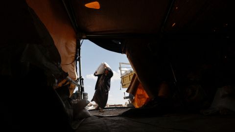 A Palestinian shepherd unloads fodder for his livestock in Masafer Yatta, south of Hebron on May 5, 2022. 