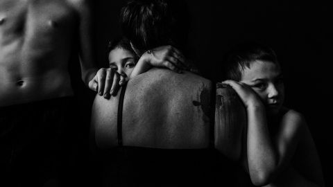 Ashley Marston has been photographing her children daily for eight years, and she has started incorporating herself into the project. She wanted "to show them that I was there, too, loving them, protecting them. ... It has been an incredibly healing experience. What at first felt really strange and awkward now feels like therapy and a way of self-expression."