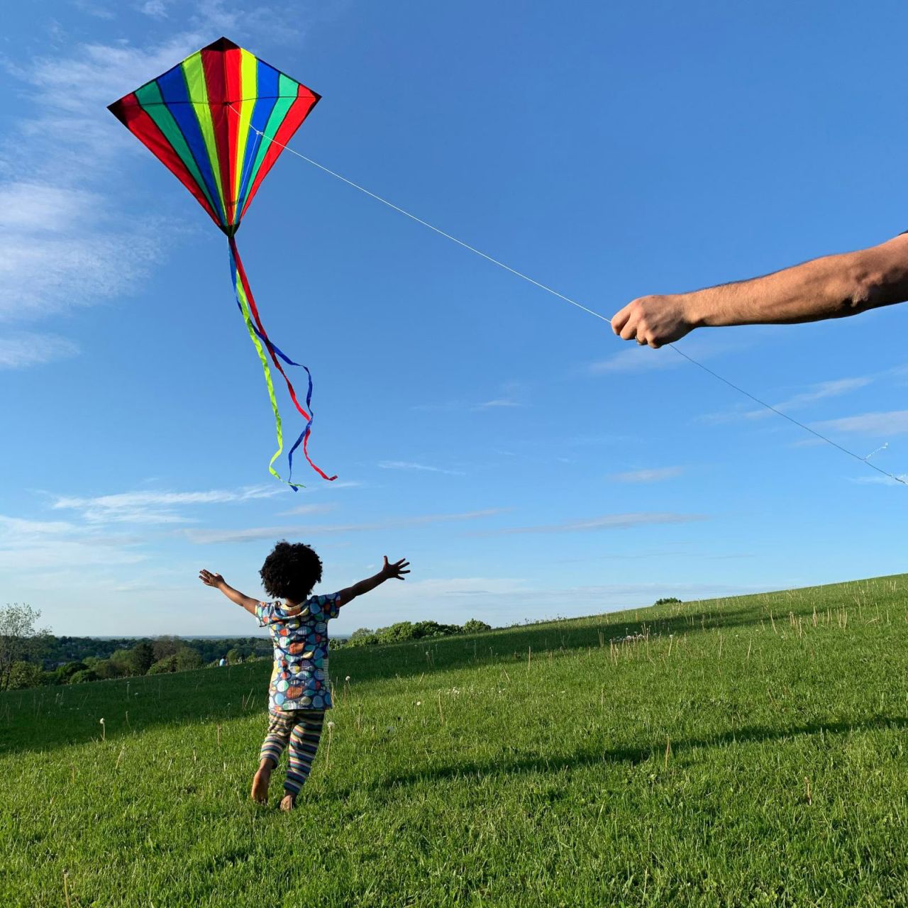 <a href="http://www.amytoensing.com/" target="_blank" target="_blank">Amy Toensing</a> photographed her daughter, Elsa, chasing a kite flown by her husband. "We were fortunate enough to become a family through adoption," she said. "Being a mom challenges, fulfills and humbles me every day. My daughter has opened my world and makes me want to know more about myself so I can be more present with her. She is the love of my life."