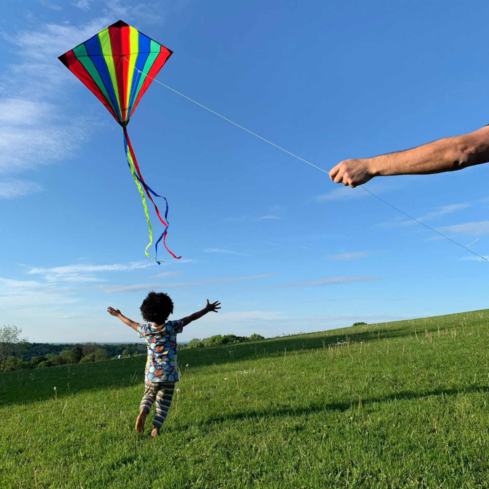 <a href="index.php?page=&url=http%3A%2F%2Fwww.amytoensing.com%2F" target="_blank" target="_blank">Amy Toensing</a> photographed her daughter,  Elsa, chasing a kite flown by her husband. "We were fortunate enough to become a family through adoption," she said. "Being a mom challenges, fulfills and humbles me every day. My daughter has opened my world and makes me want to know more about myself so I can be more present with her. She is the love of my life."