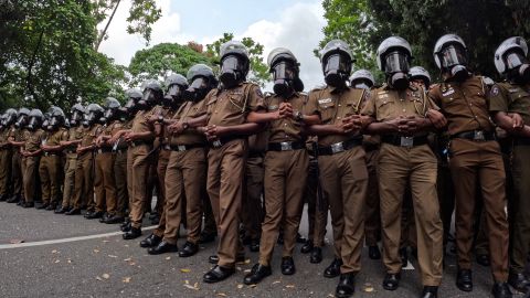 Sri Lankan police officers attend a demonstration near the parliament building in Colombo by protesters demanding President Gotabaya Rajapaksa's resignation on May 4.