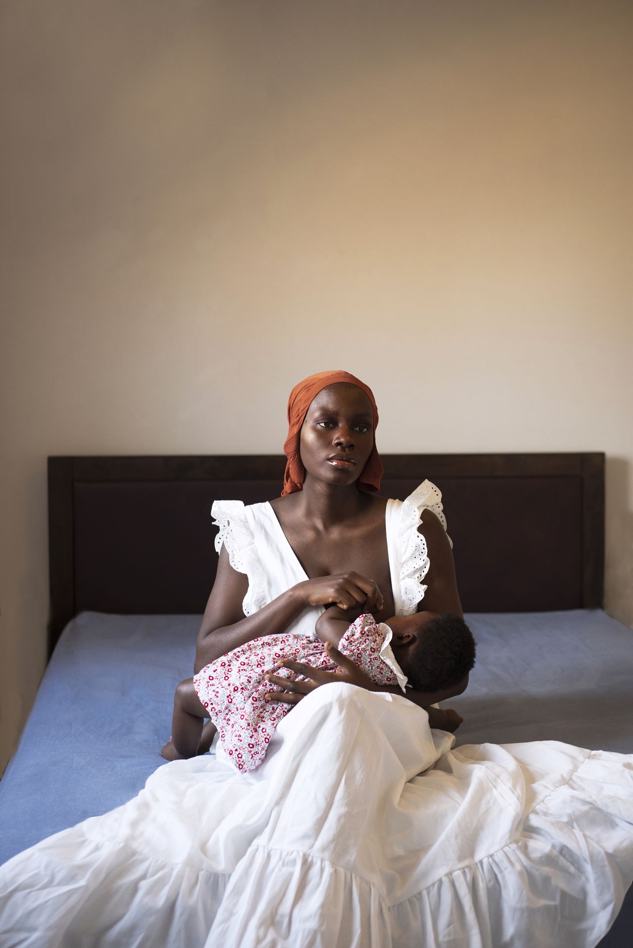 <a href="https://dolaposh.myportfolio.com/" target="_blank" target="_blank">Adenike Sogbesan</a> took this self-portrait while breastfeeding her daughter, Monioluwa."In the beginning, motherhood was overwhelming," she said. "All I did was care for my daughter. Neglecting myself and my health made me suffer from postpartum depression, but somehow I found the strength to seek help from professionals. They worked together to remind me of things that struck happiness. The answer was photography, personal care and nature. So I started making self-portraits. My biggest triumph is not having to let go of what I love: photography."