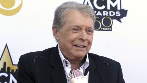 Mickey Gilley poses with the Triple Crown Award on the red carpet at the 50th annual Academy of Country Music Awards at AT&T Stadium in Arlington, Texas, April 19, 2015. 