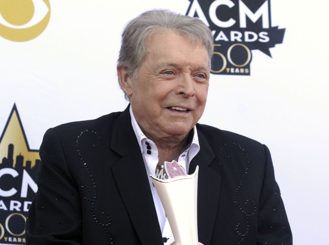 Mickey Gilley poses with the Triple Crown Award on the red carpet at the 50th annual Academy of Country Music Awards at AT&T Stadium in Arlington, Texas, April 19, 2015. 