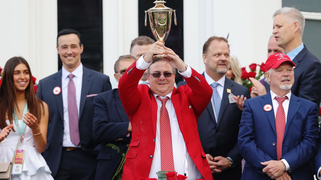 Trainer Eric Reed holds the trophy after Rich Strike's victory at the 148th running of the Kentucky Derby. 