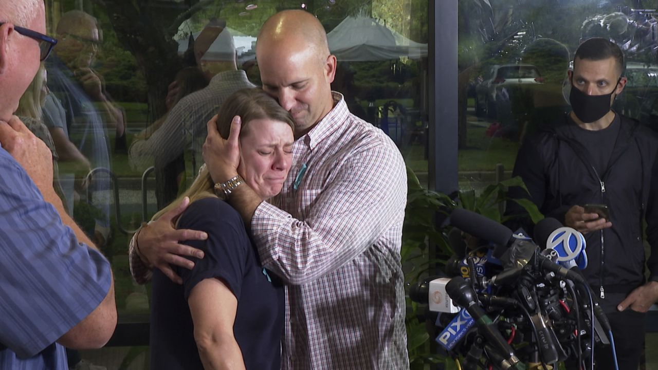 A tearful Nichole Schmidt, the mother of Gabby Petito, is comforted by her husband Jim Schmidt during a news conference on Tuesday, September 28, 2021, in Bohemia, New York.