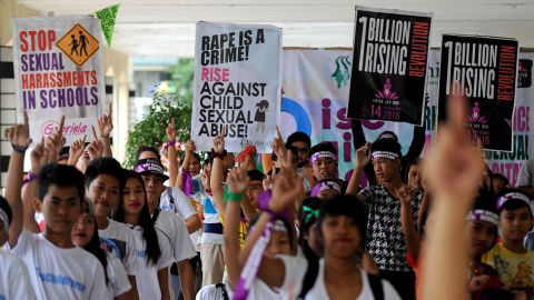 Filipino youths and children take part in a dance exercise in suburban Manila on February 6, 2016, to draw attention to sexual abuse of women and children as part of the 