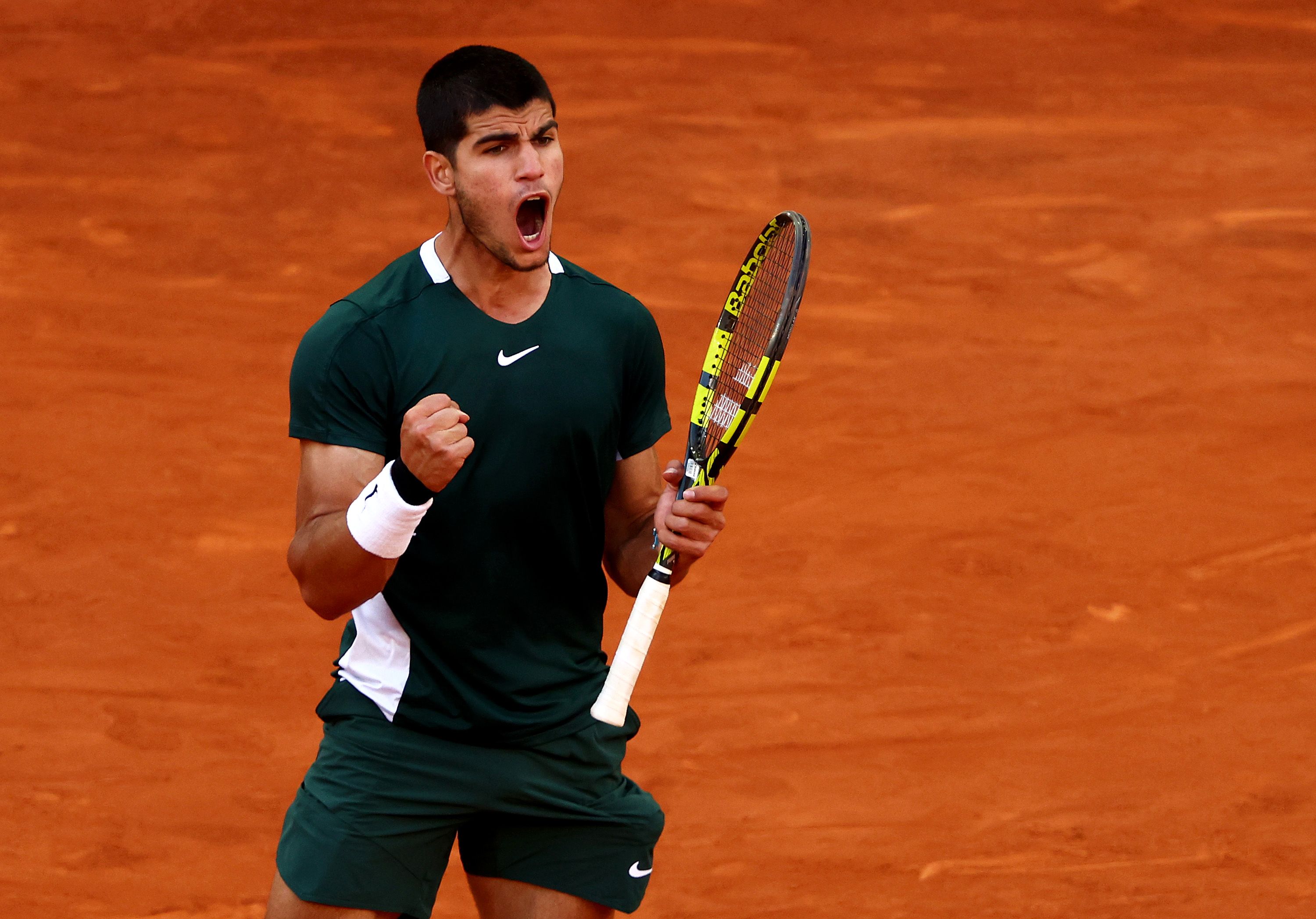 Carlos Alcaraz channels spirit of Real Madrid to defeat Novak Djokovic in  Madrid Open epic | CNN