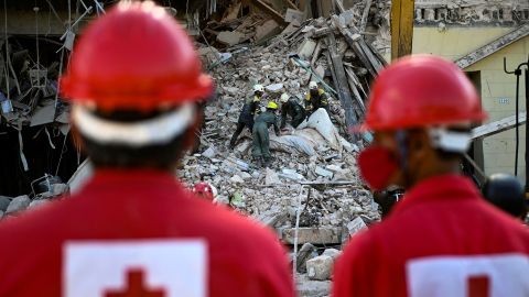 Rescuer workers remove debris from the ruins of the Hotel Saratoga, in Havana, Cuba, on Saturday, May 7, 2022.