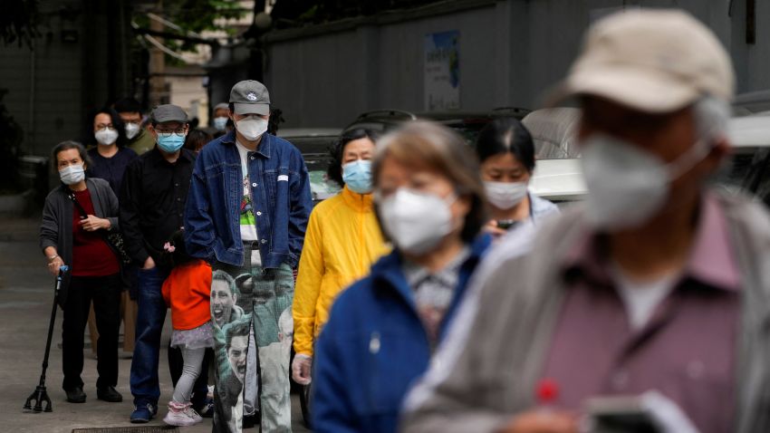 Residents line up for nucleic acid tests during lockdown, amid the coronavirus disease (COVID-19) pandemic, in Shanghai, China, May 9, 2022. REUTERS/Aly Song