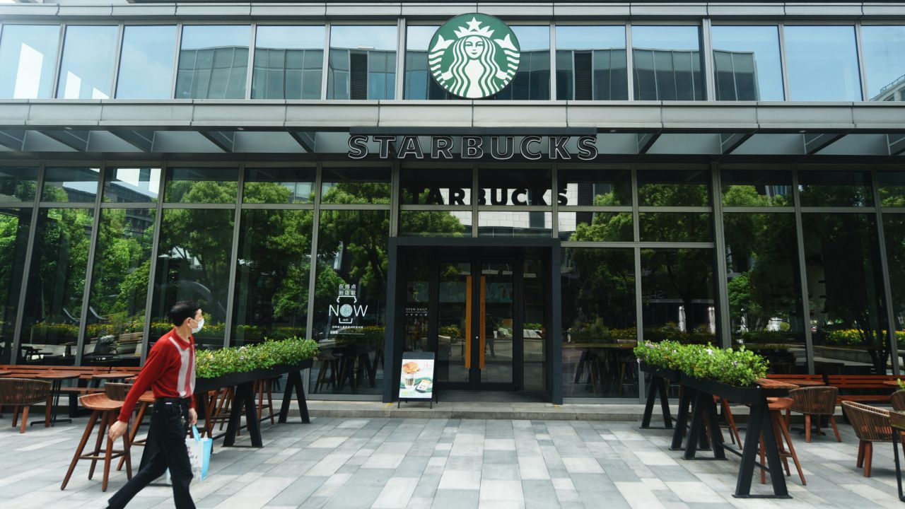 A pedestrian walking by a closed Starbucks outlet in Hangzhou in April.